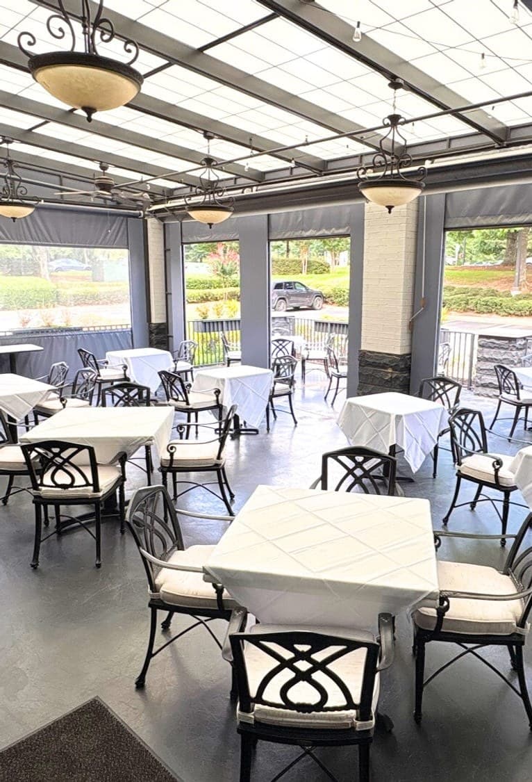The patio at Luci's under bistro lighting